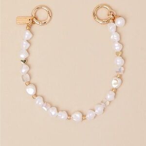 Lulu's White and Gold charm